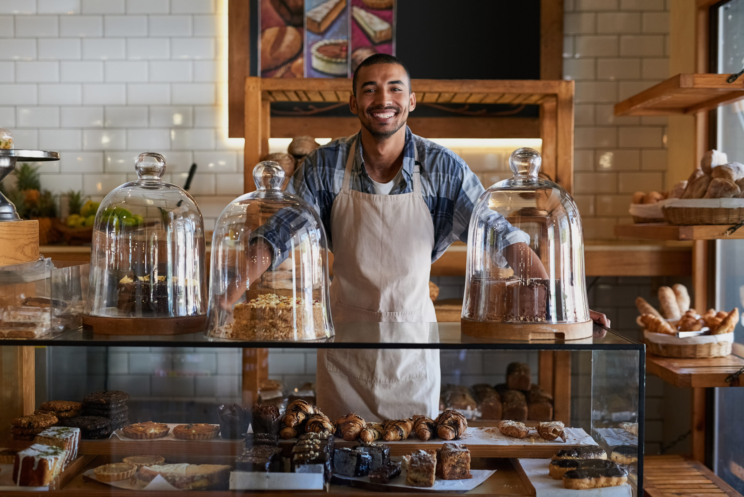 Bakery Business Owner smiling behind the counter
